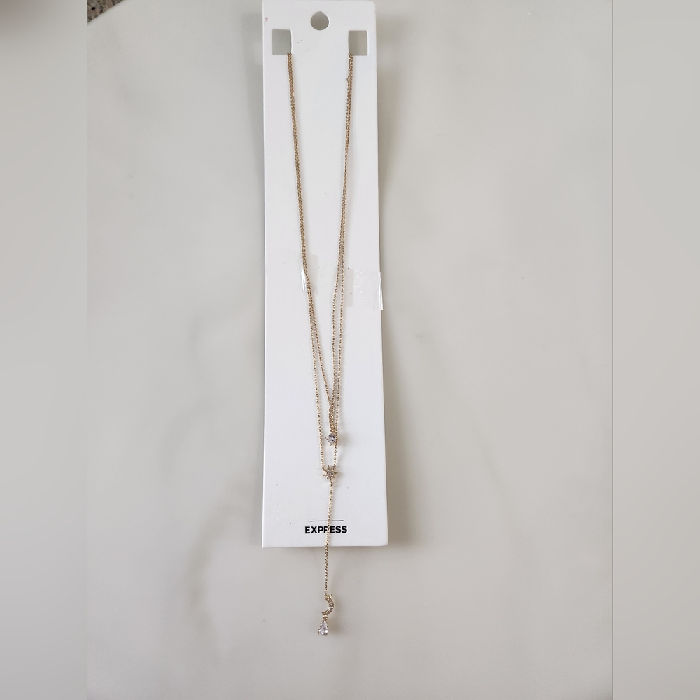 Express Gold Tone Layered Necklace. Crystal pendents